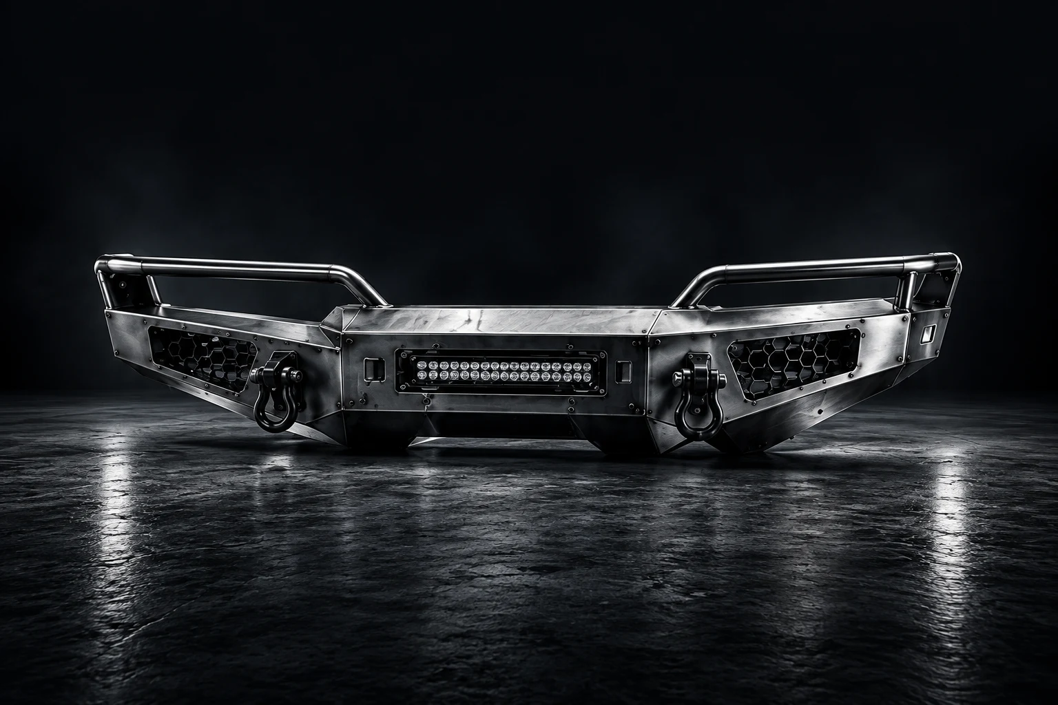 Illustrative brushed-steel bumper with side rails and recovery mounts